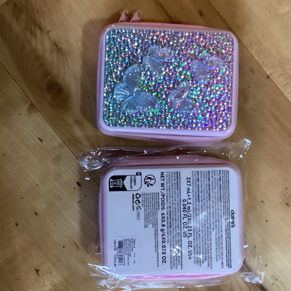 One Claire's Pink Glitter Butterfly makeup set includes eyeshadow, 3 gloss